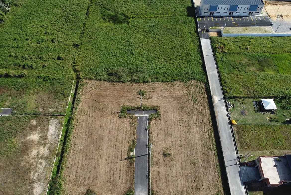 Cornerstone- Aerial view of vacant land on St Louis Dr, Longdenville with surrounding properties.