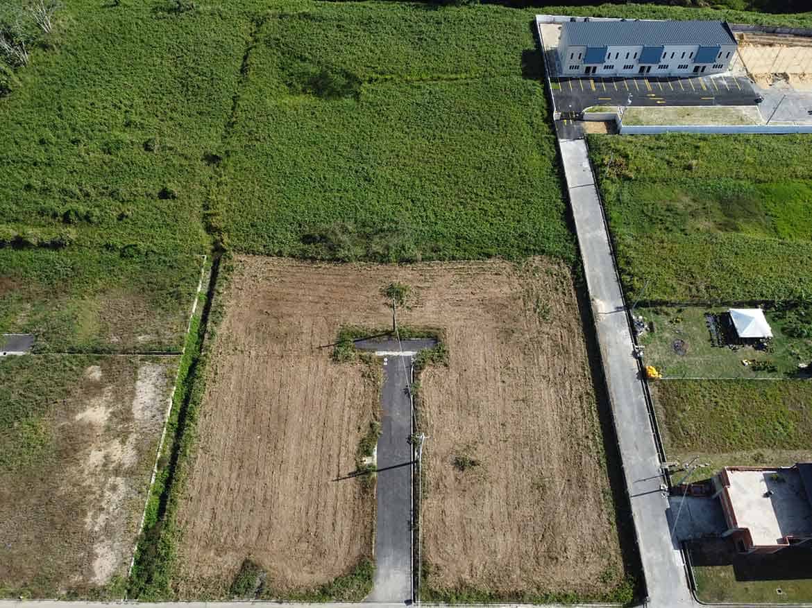 Cornerstone- Aerial view of vacant land on St Louis Dr, Longdenville with surrounding properties.
