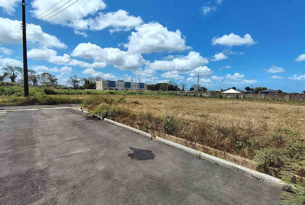 Cornerstone- Vacant land plot with clear sky near St Louis Dr, Longdenville.