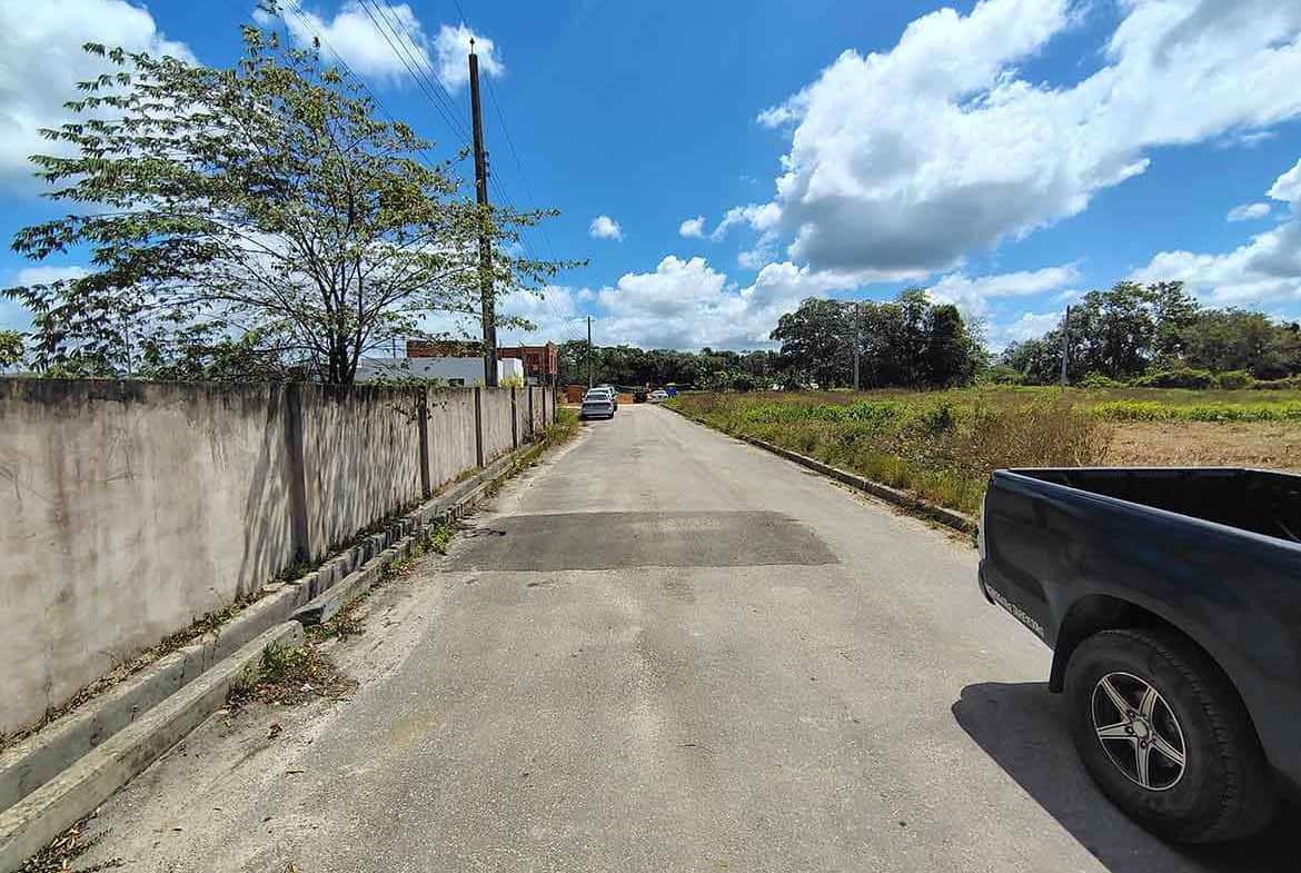 Cornerstone- Quiet street scene on St Louis Dr, Longdenville with blue sky and clouds.