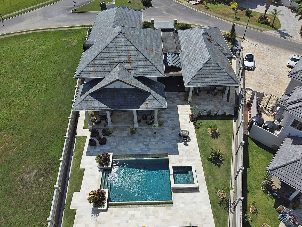 Millennium Lakes Home with Pool Cornerstone- Aerial view of Millennium Lakes home with pool and landscaped yard.