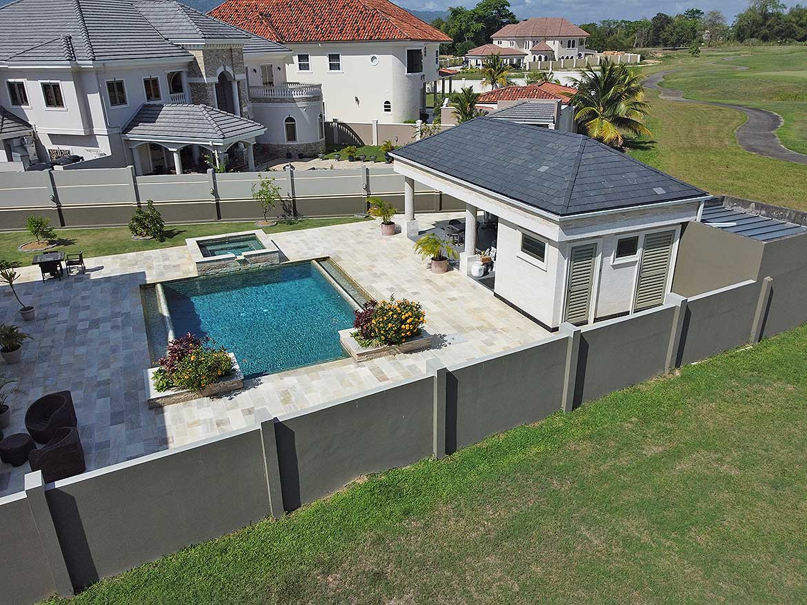 Luxury backyard with pool at Millennium Lakes Cornerstone- Modern backyard with pool, patio, and garden at Millennium Lakes Home.