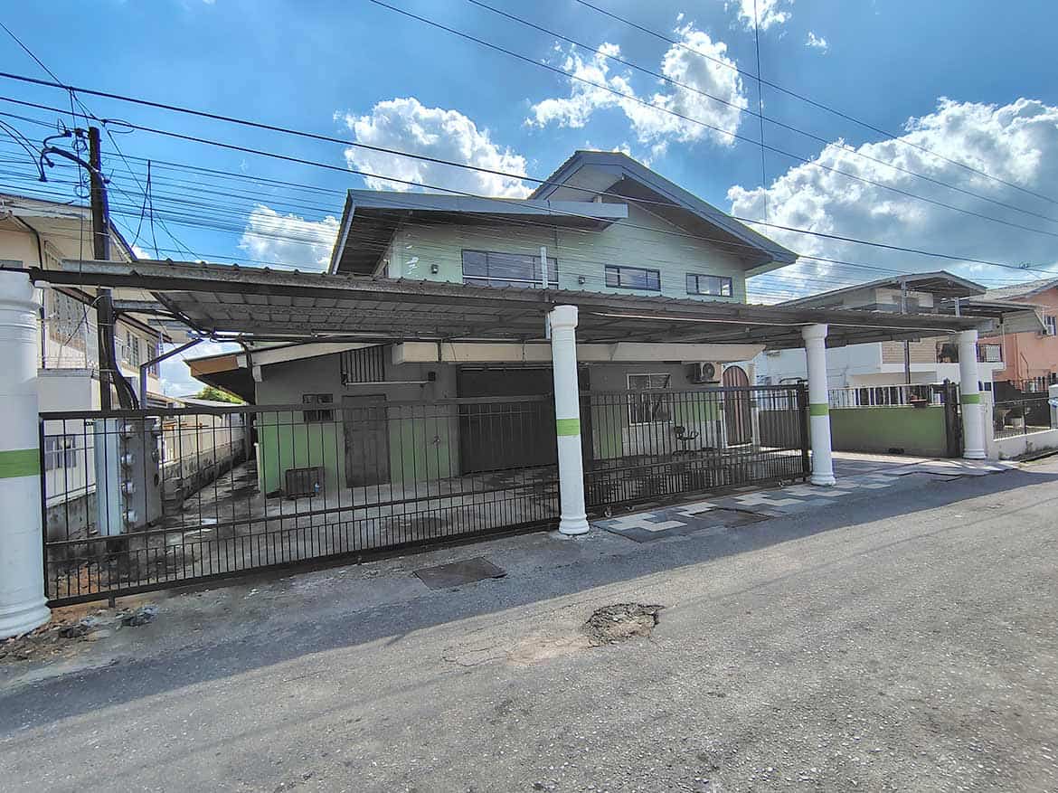 Ganga Terrace Residential Home Cornerstone- Residential house with carport and white pillars in El Socorro.