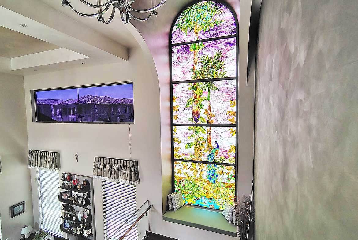 Cornerstone- Bright interior with large stained glass window and modern decor.