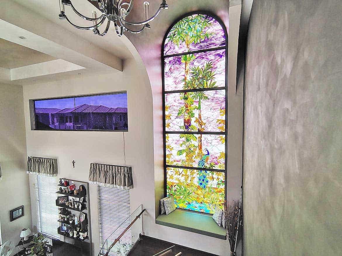 Cornerstone™ Millennium Lakes Home Interior Cornerstone- Bright interior with large stained glass window and modern decor.