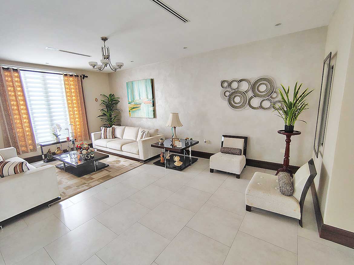 Millennium Lakes Home Living Room Cornerstone- Spacious living room with modern decor and natural light.