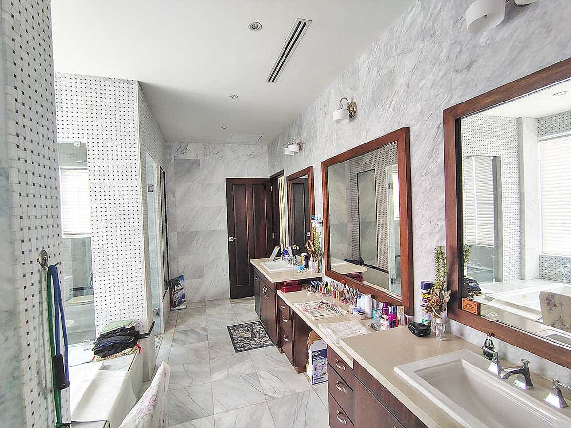 Luxury Bathroom at Millennium Lakes Home Cornerstone- Elegant bathroom with dual sinks, large mirrors, and modern fixtures at Millennium Lakes Home.