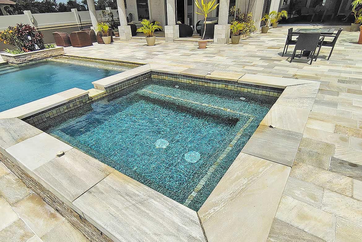Cornerstone- Modern outdoor pool with hot tub and lounge area at Millennium Lakes.