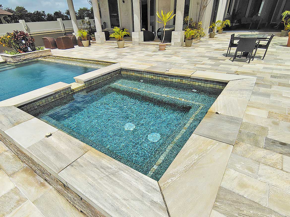 Luxury Pool and Hot Tub at Millennium Lakes Cornerstone- Modern outdoor pool with hot tub and lounge area at Millennium Lakes.