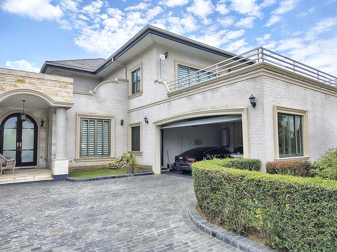 Luxury Home at Millennium Lakes Cornerstone- Elegant modern house with driveway and garage at Millennium Lakes.