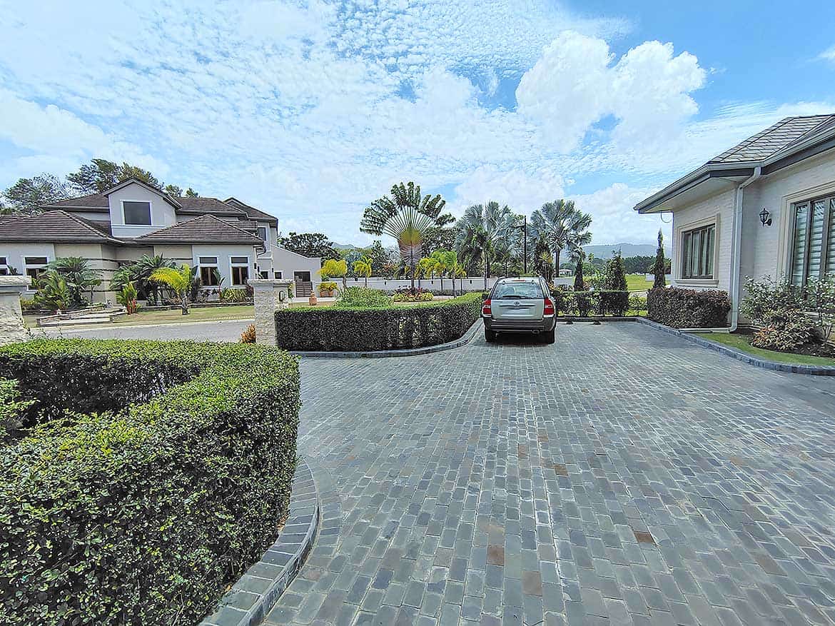 Millennium Lakes Home Driveway Cornerstone- Spacious driveway with parked car at Millennium Lakes Home.