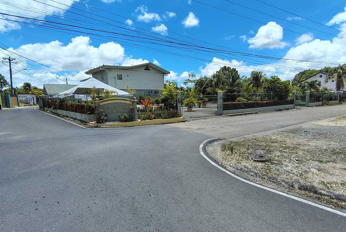 Cornerstone- Residential property on Ajim Baksh Road with garden and driveway.