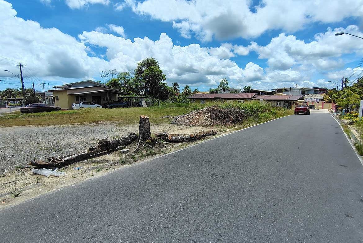 Cornerstone- View of Ajim Baksh Road with residential area and blue sky.