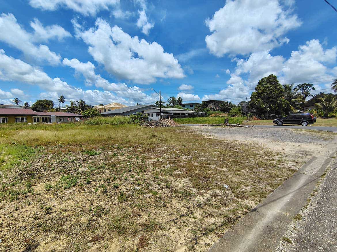 Open Lot on Off Ajim Baksh Road Cornerstone- Empty lot with grass and dirt on Off Ajim Baksh Road under blue sky.