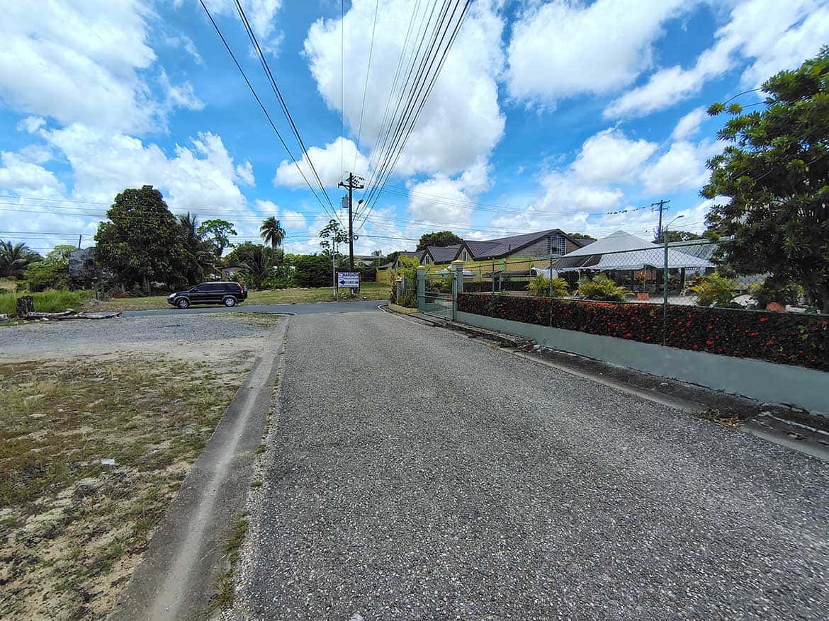 Cornerstone™ on Ajim Baksh Road Cornerstone- Street view of Ajim Baksh Road with houses and power lines.