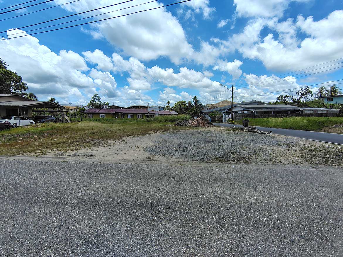 Development Site on Off Ajim Baksh Road Cornerstone- Vacant land on Off Ajim Baksh Road with houses in the background.