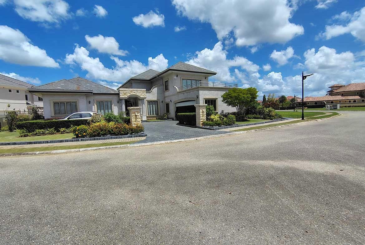 Cornerstone- Modern luxury house in Millennium Lakes community with landscaped yard.