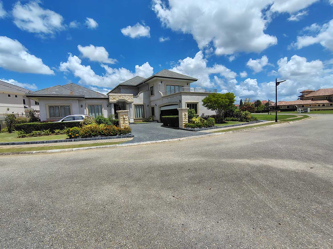 Luxury Home in Millennium Lakes Cornerstone- Modern luxury house in Millennium Lakes community with landscaped yard.