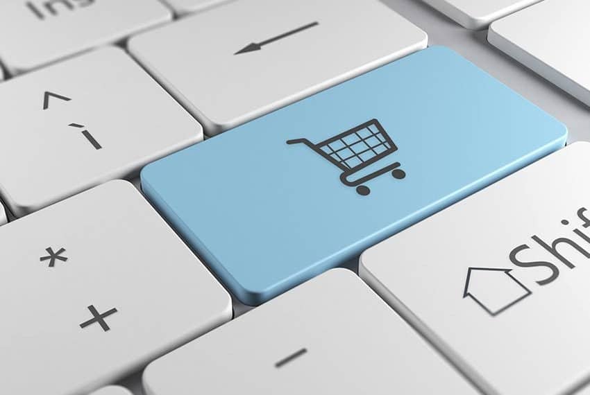 Cornerstone- Blue shopping cart icon on a computer keyboard key.