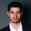 Cornerstone- Confident young man with blue eyes in formal suit for professional image.