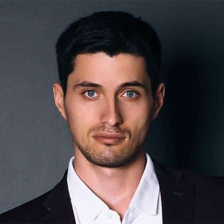 Cornerstone- Confident young man with blue eyes in formal suit for professional image.