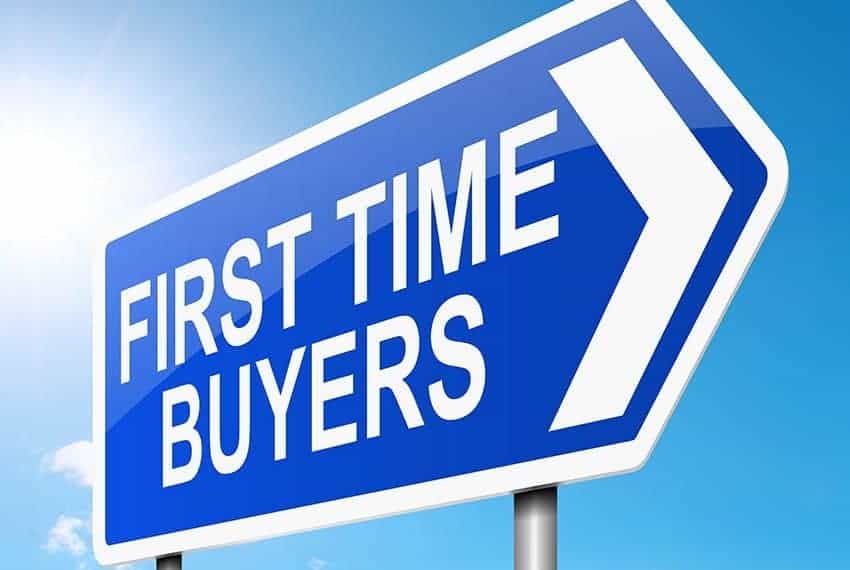 Cornerstone- Directional sign for first time home buyers with blue sky background.