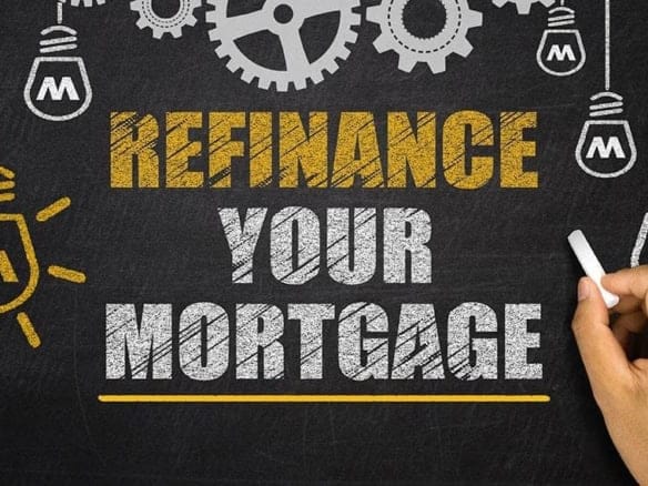 Cornerstone- Hand writing 'Refinance Your Mortgage' on blackboard with gears and lightbulb icons.