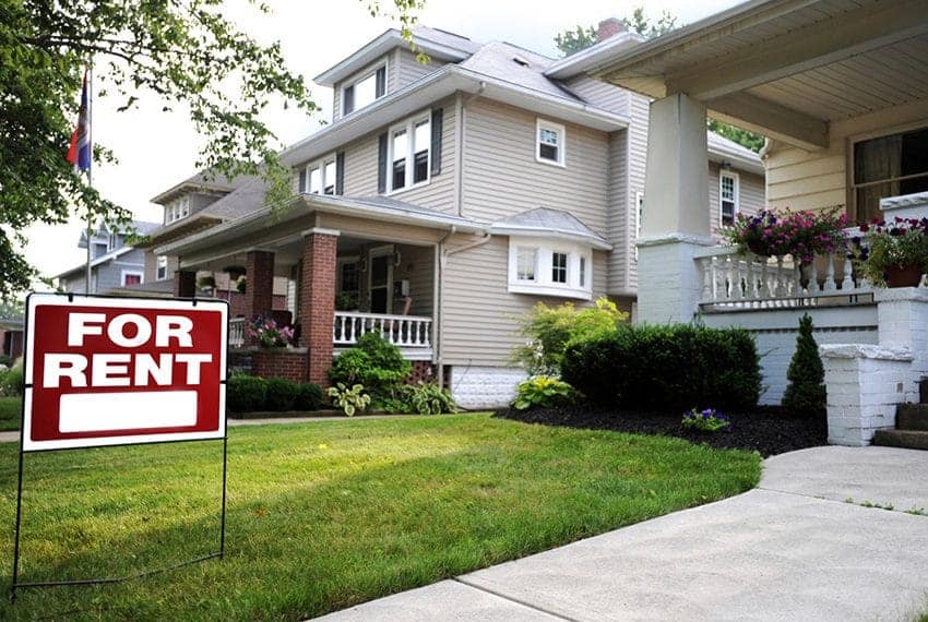 Cornerstone- Residential house with a for rent sign in the yard.