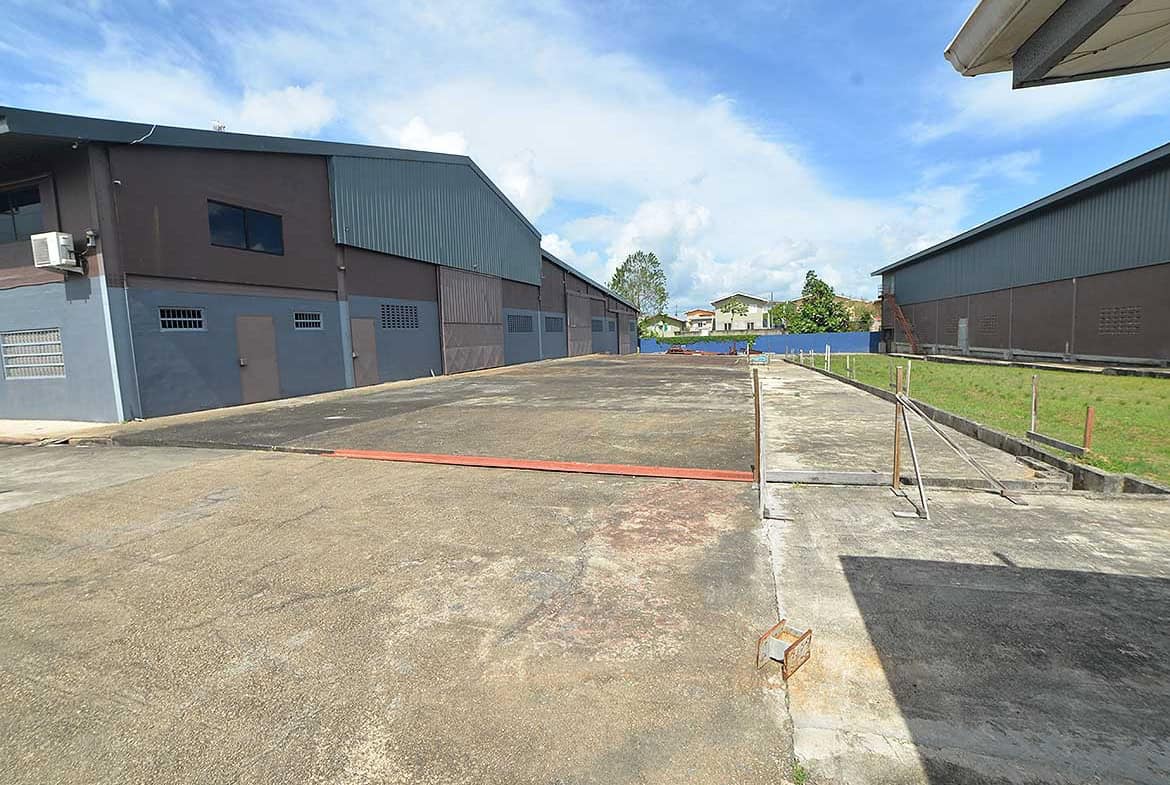 Cornerstone- Empty industrial lot with warehouses in O'Meara, Trinidad.