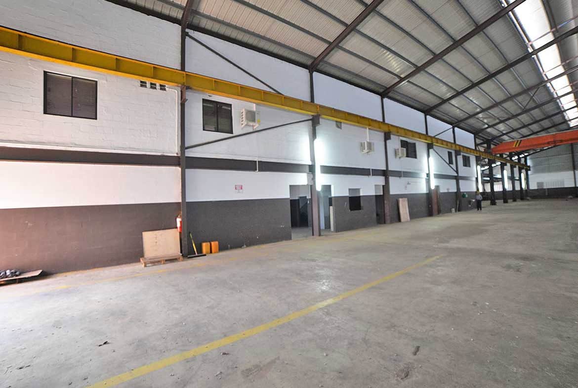 Cornerstone- Interior view of the e TecK Building at O'meara, showcasing industrial warehouse space.