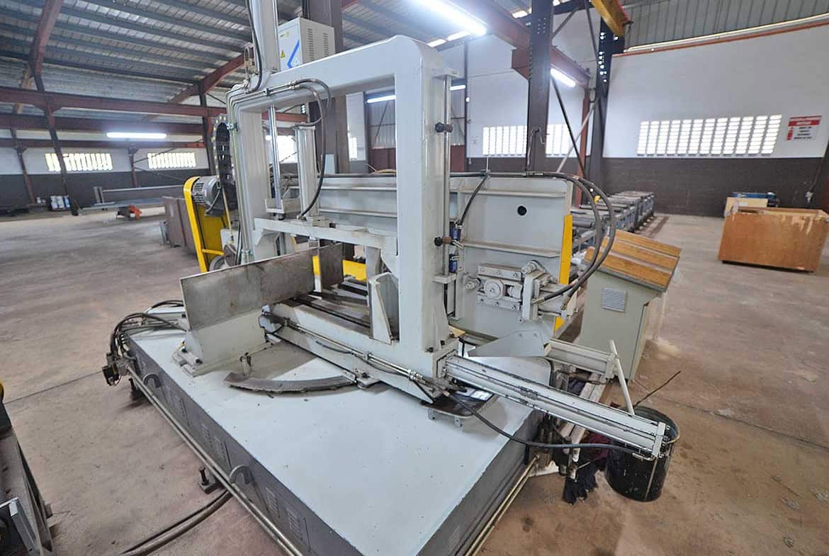 Cornerstone- Industrial cutting machine in a factory setting at Cornerstone.