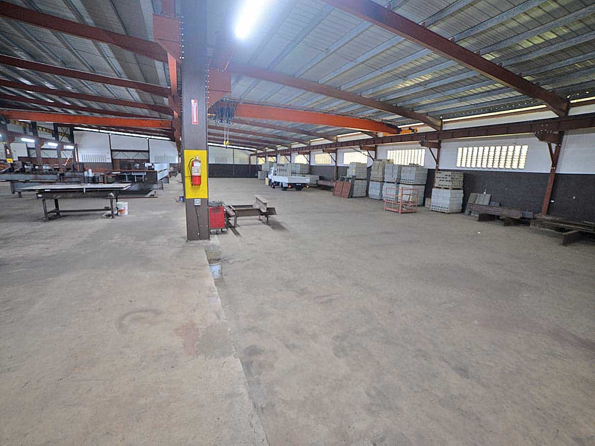 Industrial Warehouse at e TecK Building Cornerstone- Spacious industrial warehouse with storage racks and work areas at e TecK Building.