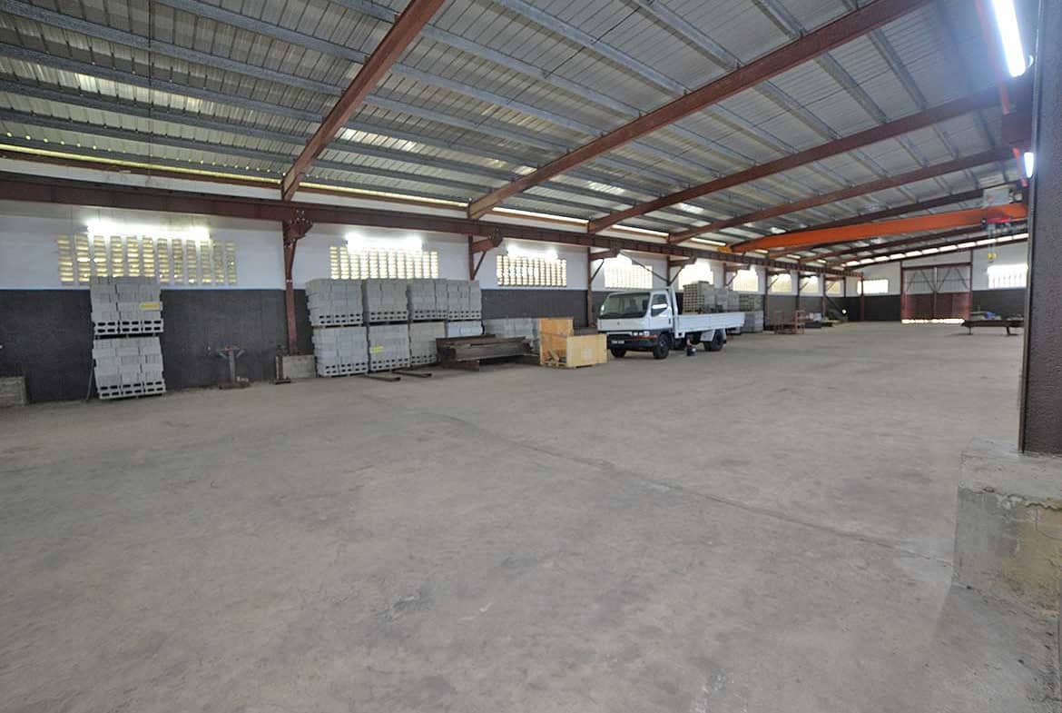 Cornerstone- Spacious warehouse at e TecK Building O'meara with construction materials.