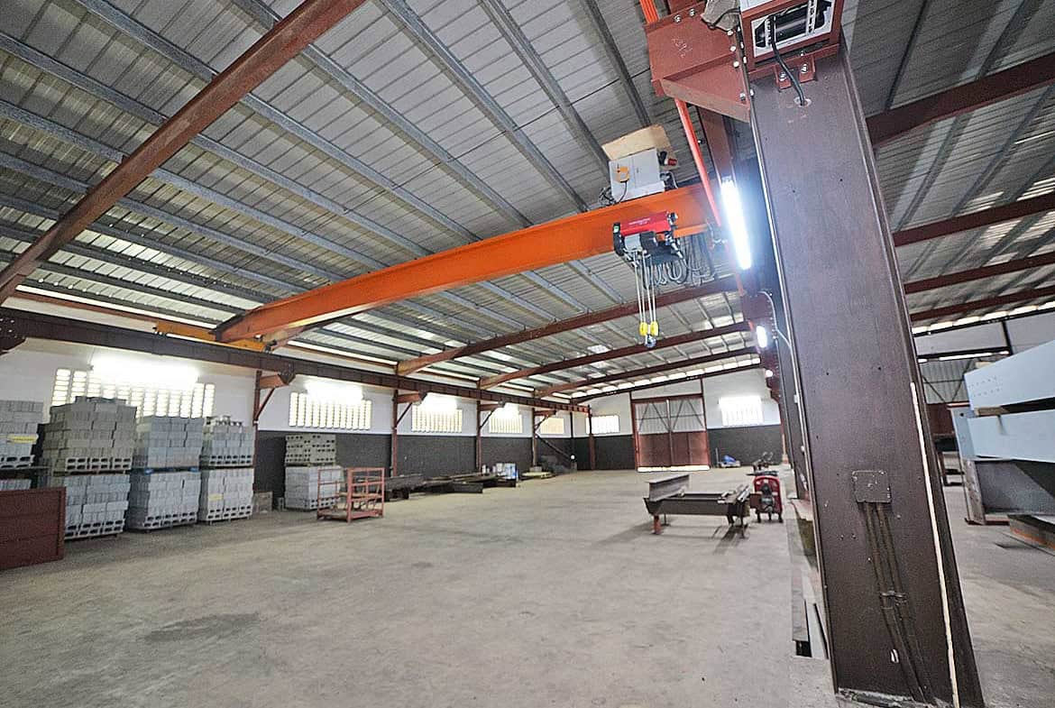 Cornerstone- Large industrial crane inside e TecK Building in O'meara for manufacturing.