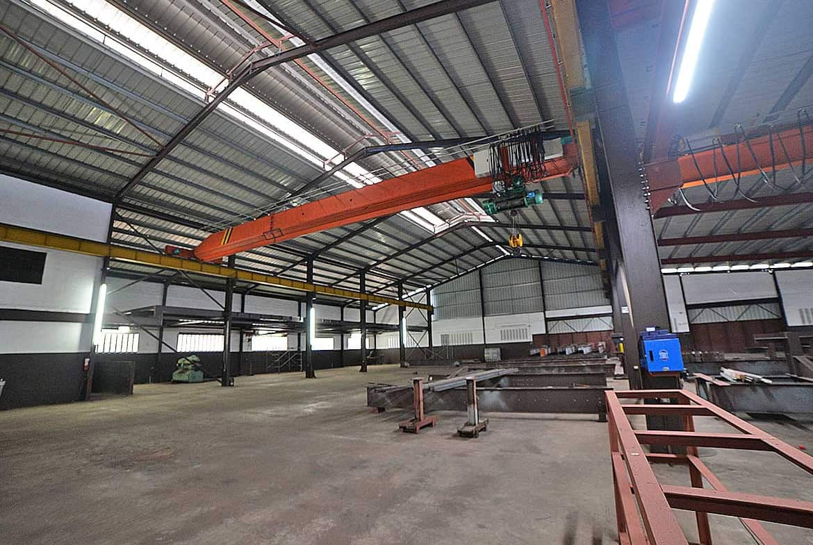 Cornerstone- Large orange overhead crane inside e TecK Building in O'meara.