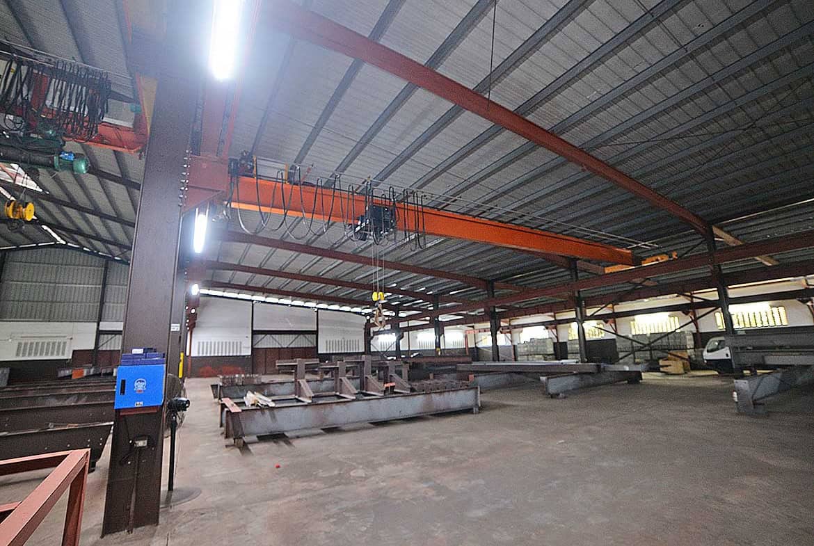 Cornerstone- Interior view of the e TecK Building in O'meara with industrial equipment.