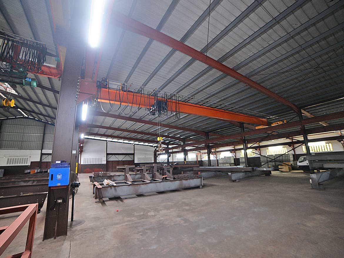 e TecK Building O’meara Interior Cornerstone- Interior view of the e TecK Building in O'meara with industrial equipment.