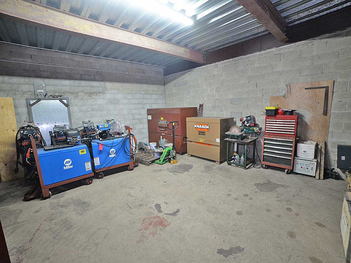 Workshop Storage Area at e TecK Building Cornerstone- Industrial workshop storage with tools, equipment, and machinery in O'meara.