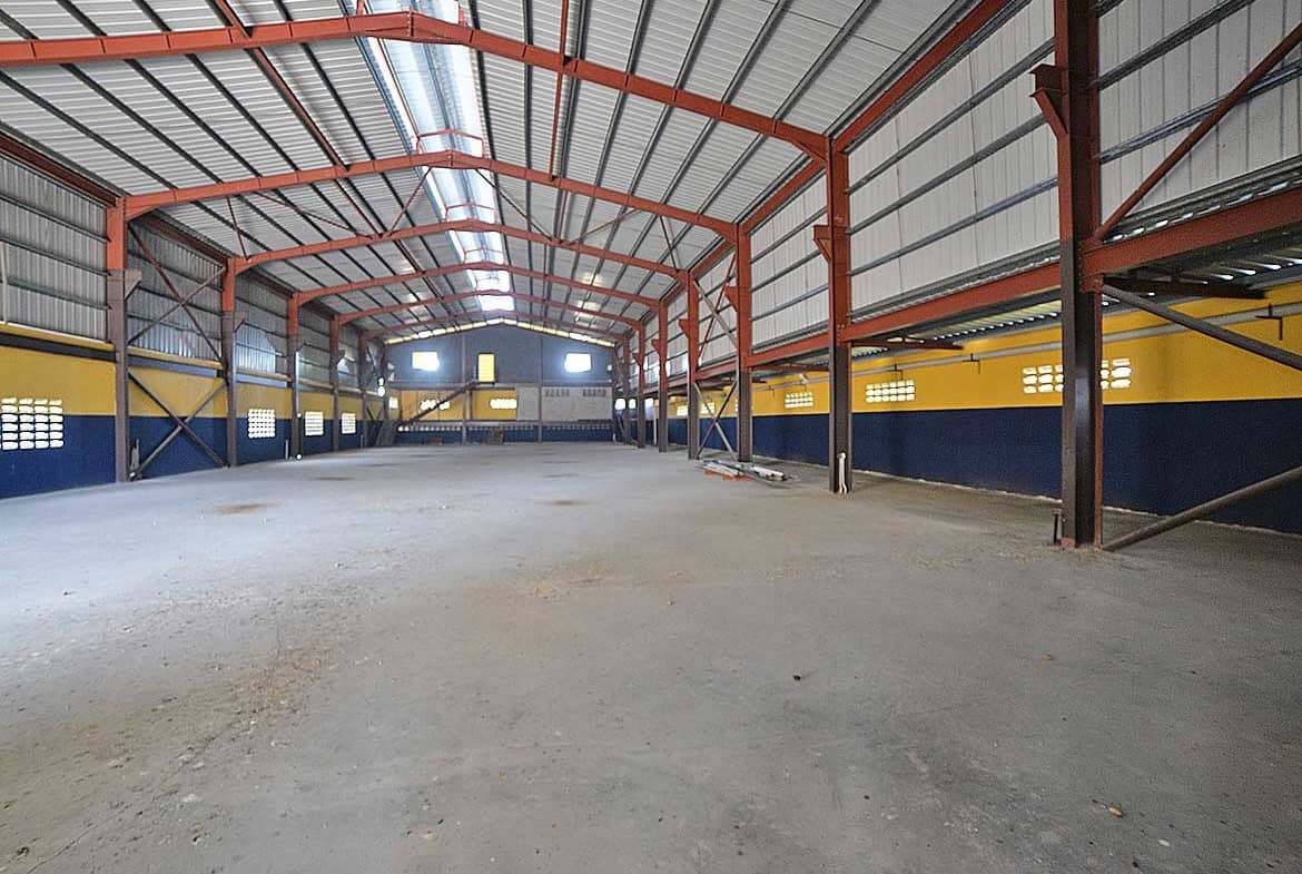 Cornerstone- Spacious industrial warehouse interior at Cornerstone with steel framework.