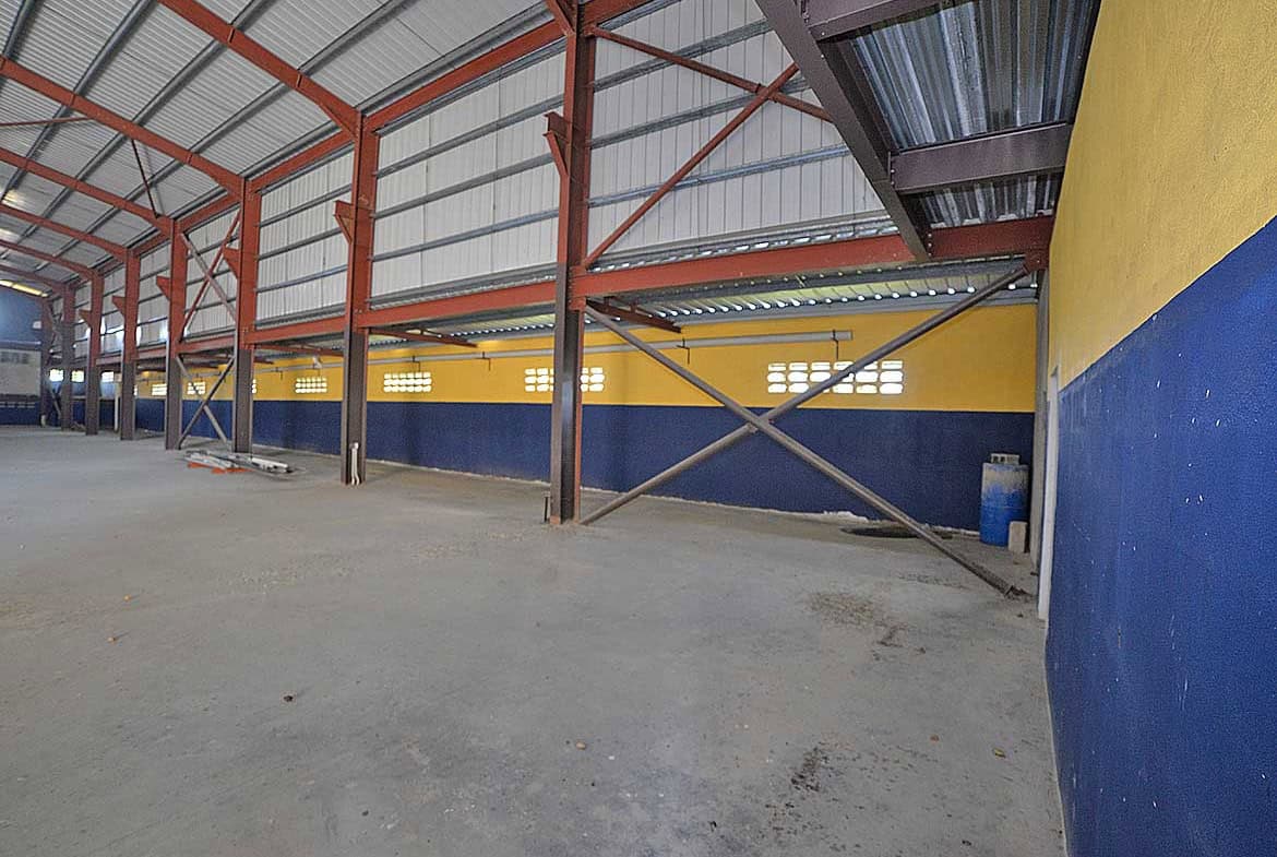 Cornerstone- Interior view of the e TecK building at O'meara with colorful walls and steel structure.