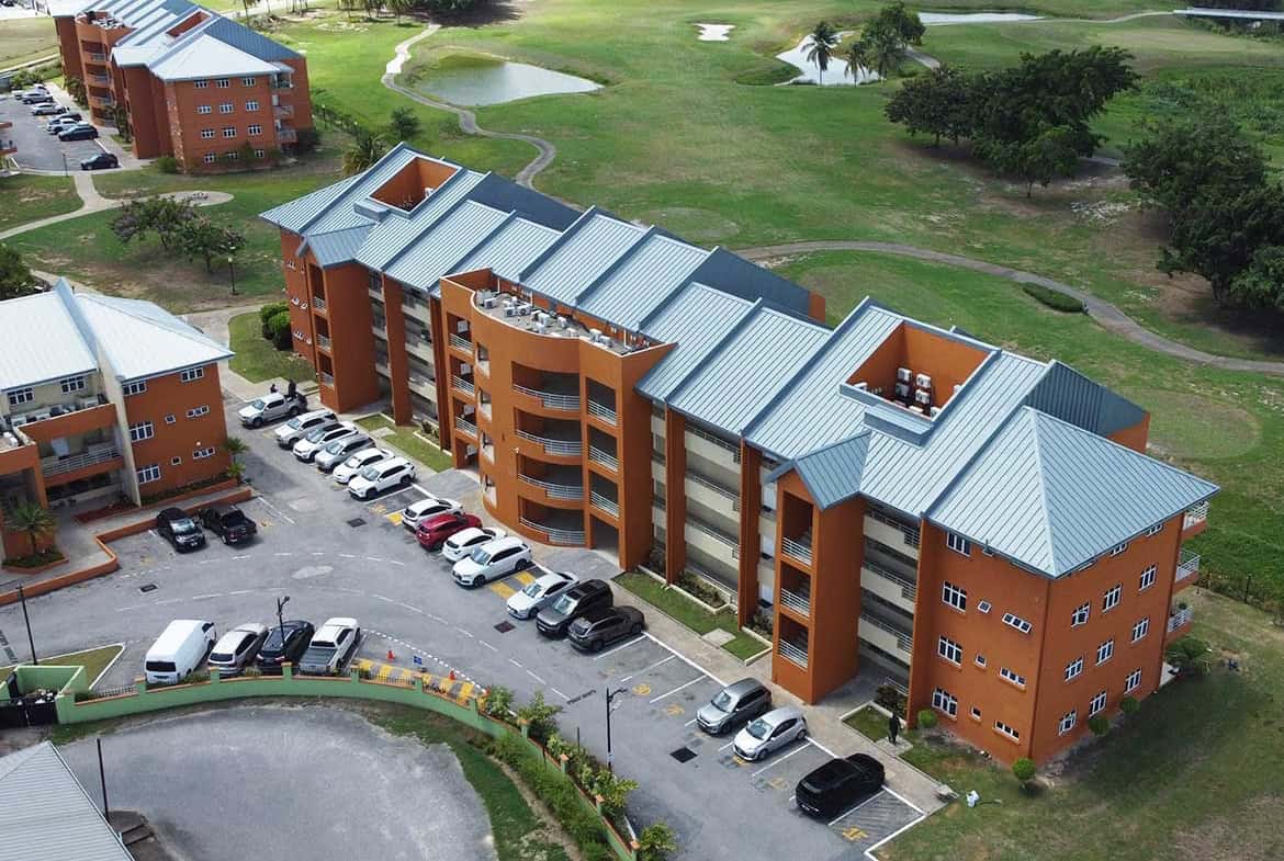 Aerial view of EastGate on the Greens residential apartments and parking lot.