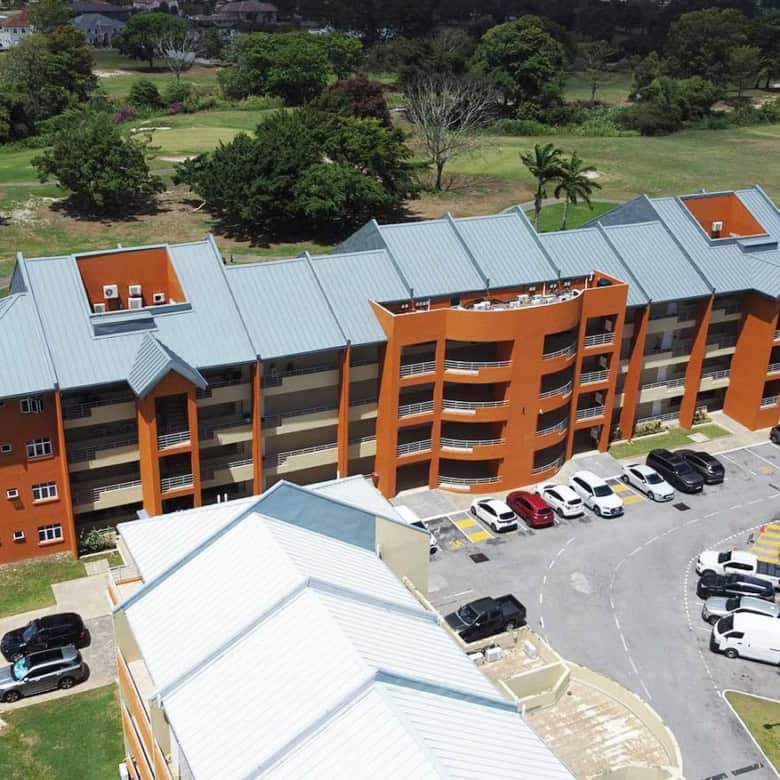 Aerial view of EastGate on the Greens residential complex with parking lot.
