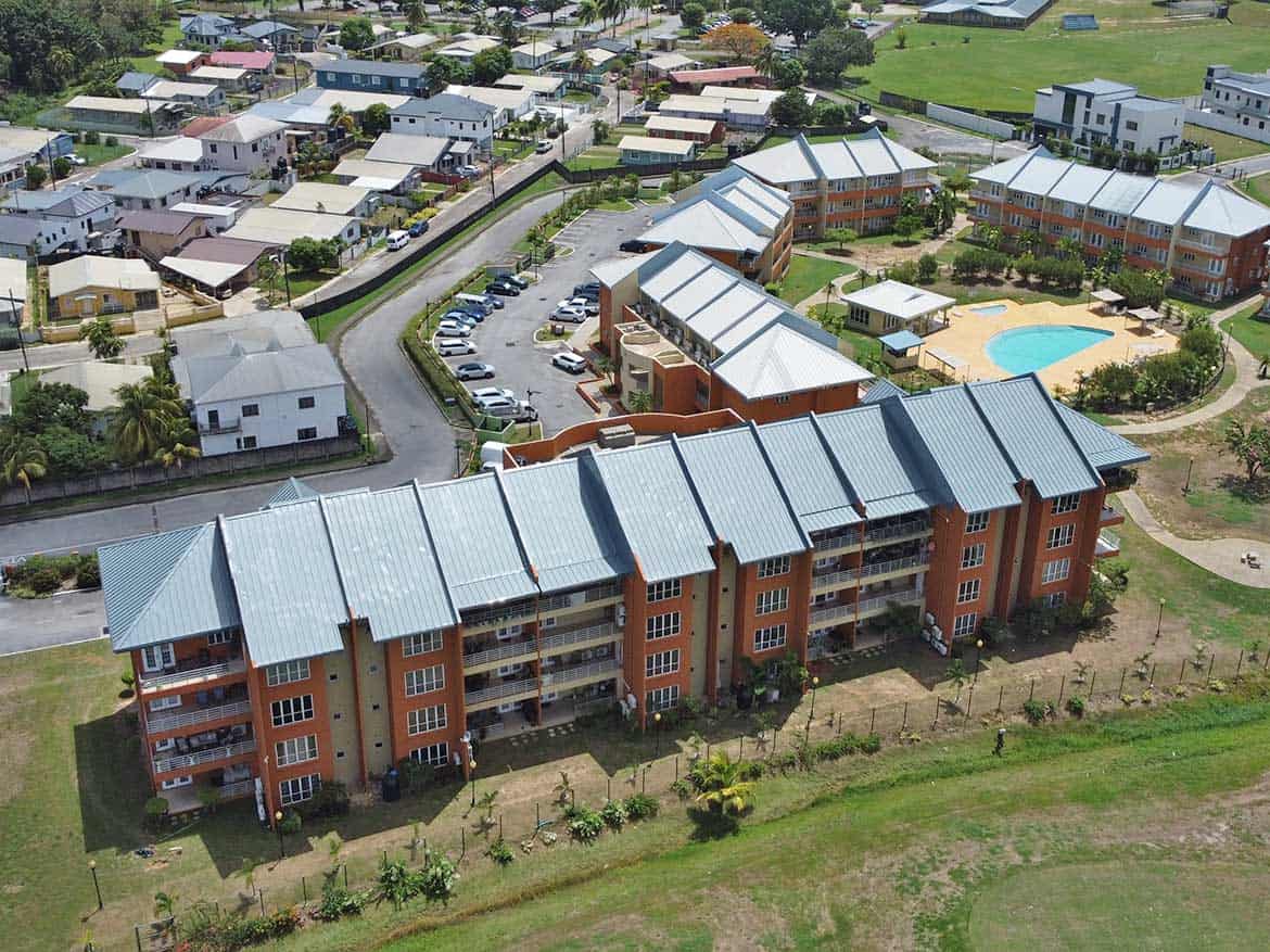 EastGate on the Greens Residential Complex Aerial view of EastGate on the Greens residential apartments with pool and surrounding neighborhood.