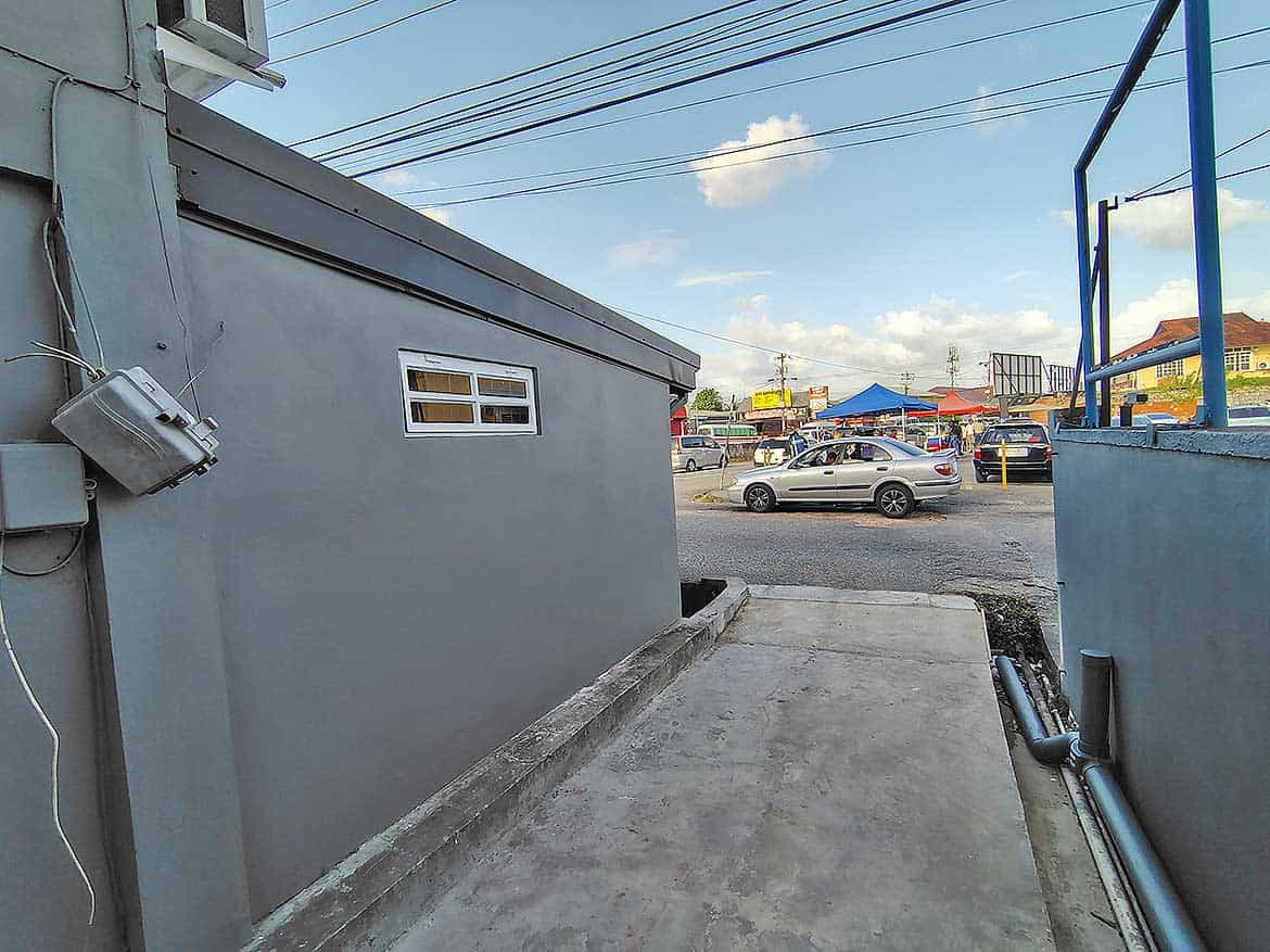 Commercial Space in Curepe Cornerstone- Outdoor view of commercial space in Curepe with parking and street scene.