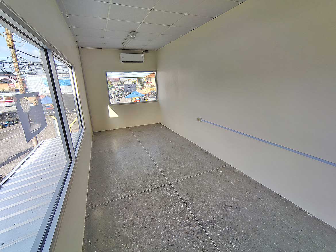 Commercial Space Interior Curepe Cornerstone- Empty commercial space with large windows in Curepe for lease or sale.