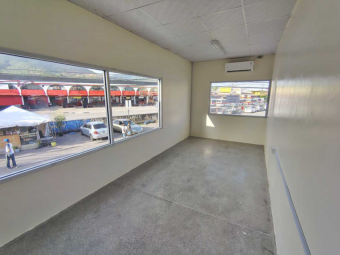 Commercial Space Interior in Curepe Cornerstone- Empty commercial space with large windows in Curepe, Trinidad.