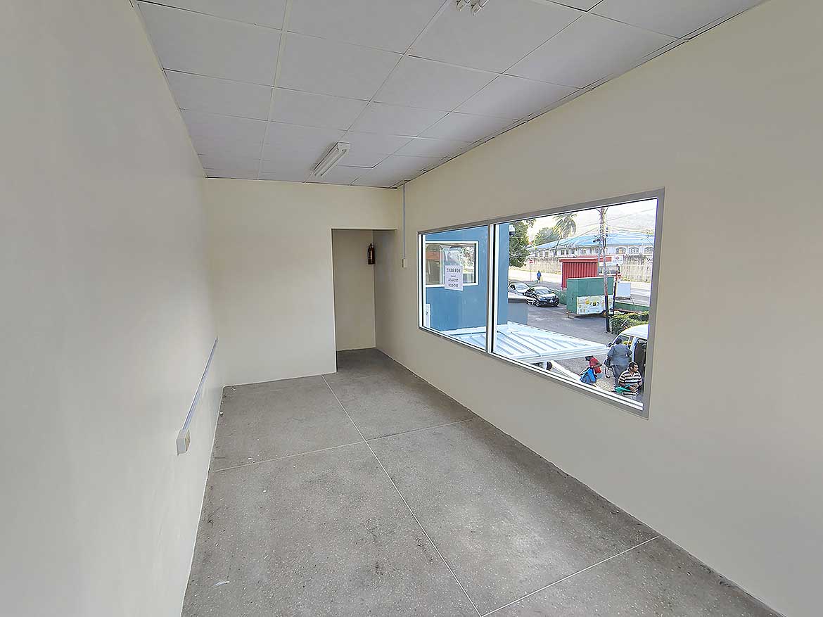 Commercial Space Interior in Curepe Cornerstone- Empty commercial space with large window in Curepe, Trinidad.