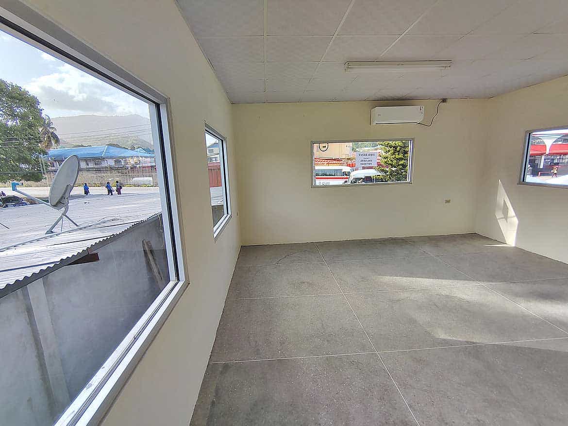 Commercial Space Interior in Curepe Cornerstone- Spacious commercial room with large windows and air conditioning in Curepe.