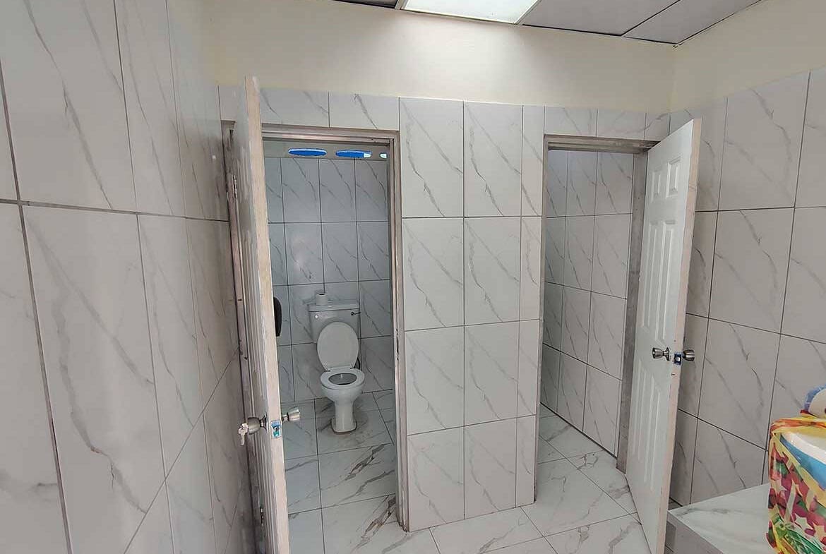 Cornerstone- Restroom with two stalls in a commercial space in Curepe.
