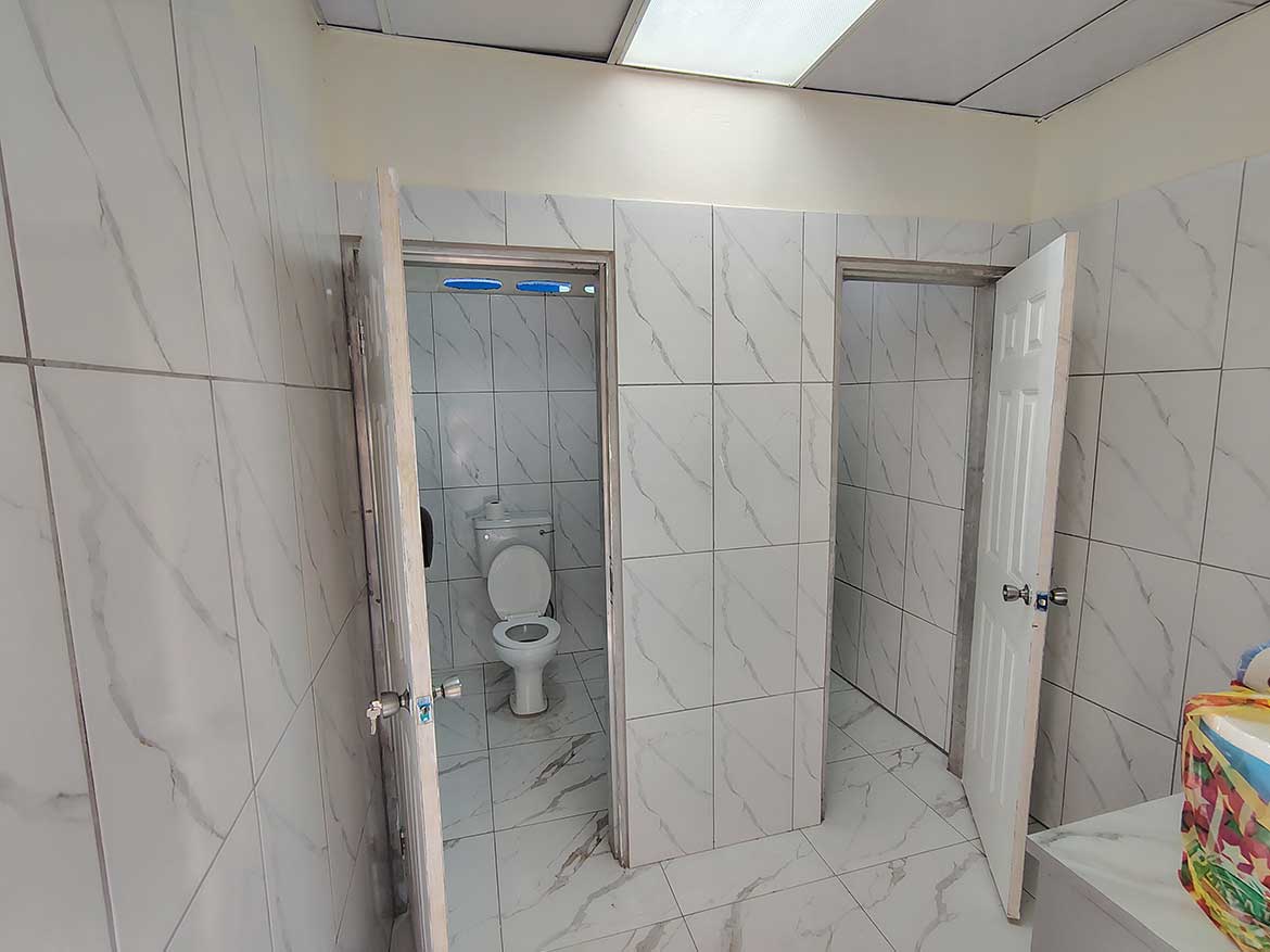 Commercial Space Restroom in Curepe Cornerstone- Restroom with two stalls in a commercial space in Curepe.